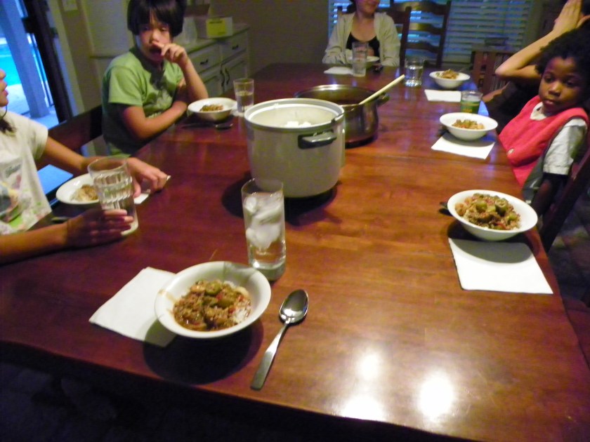 Here's my family gathered around the table to enjoy some homemade gumbo.